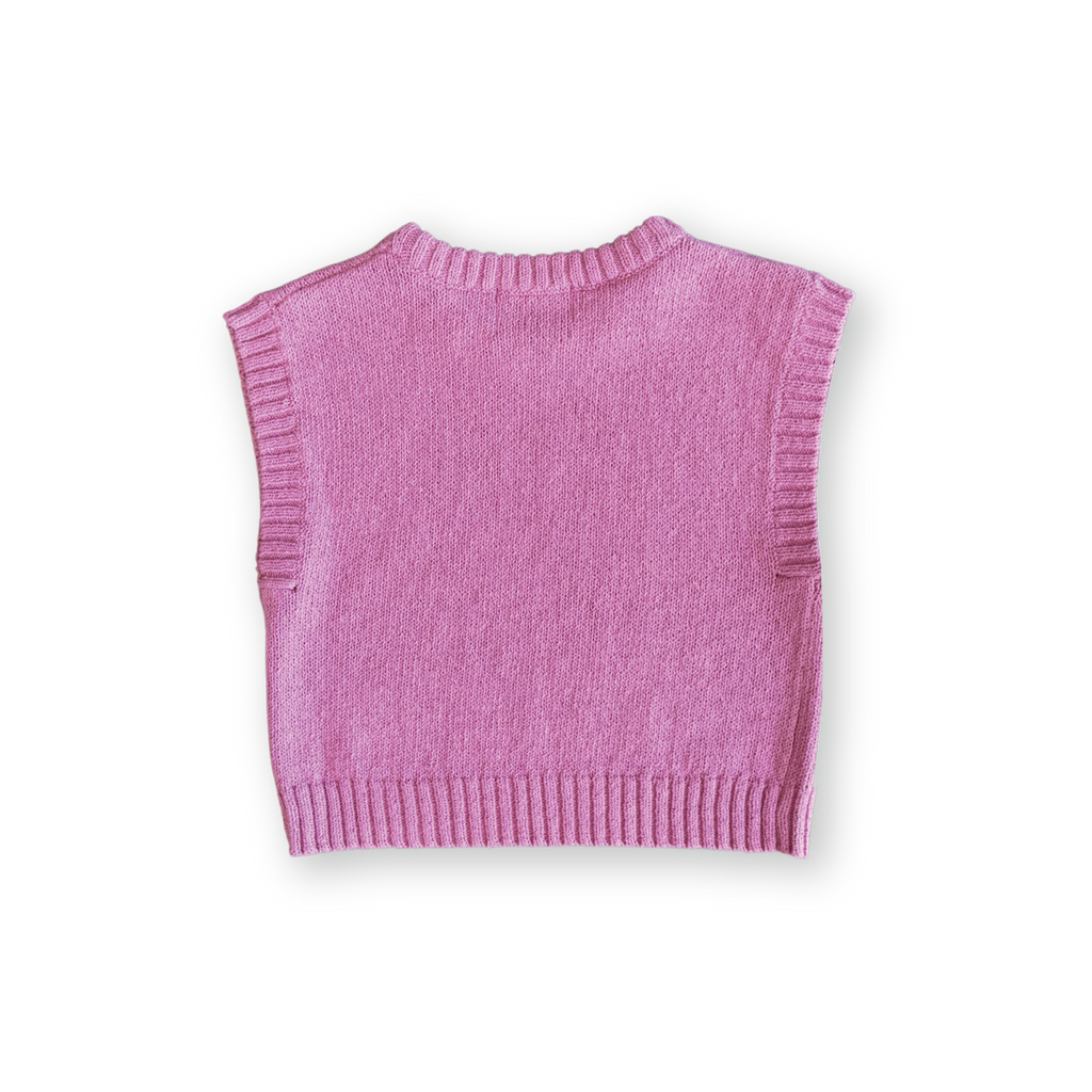 Pink knitted vest on a white background